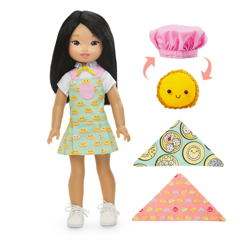 Asian American doll named Jilly next to accessories including L'il Tart, a small, cheerful, sun-shaped pastry character.