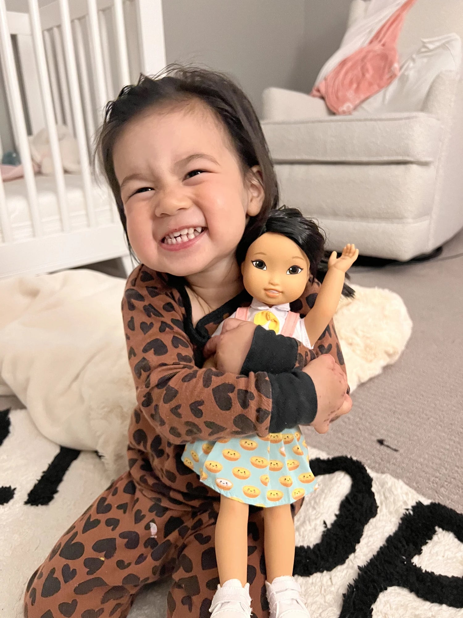 Girl hugging the Jilly doll